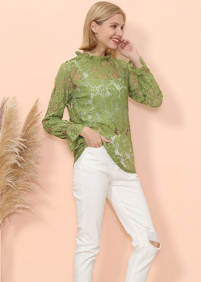 Blusa transparente con mangas abullonadas y encaje en capas