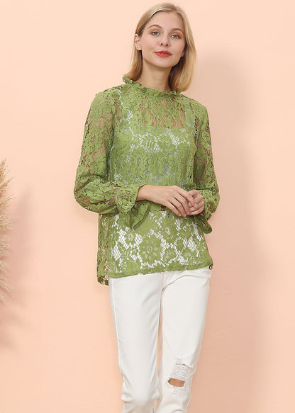 Blusa transparente con mangas abullonadas y encaje en capas