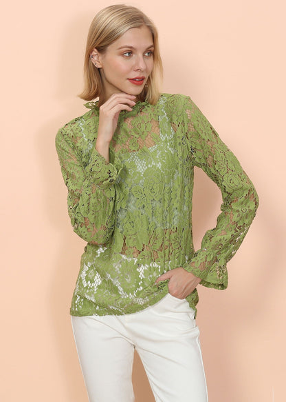 Blusa transparente con mangas abullonadas y encaje en capas