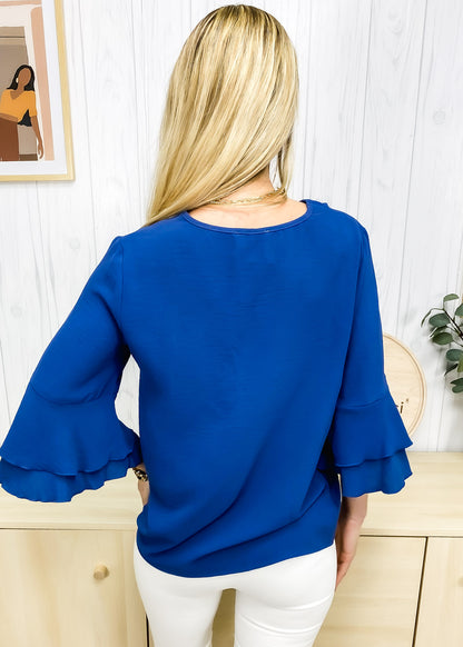 Blusa con mangas con volantes en capas