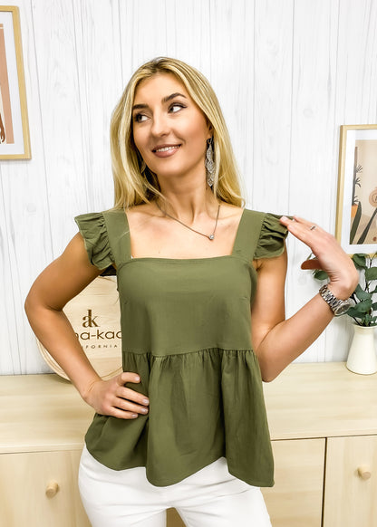 Blusa ligera con peplum y volantes