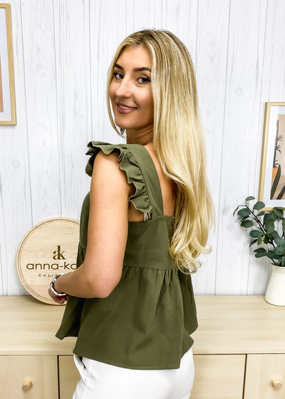 Blusa ligera con peplum y volantes