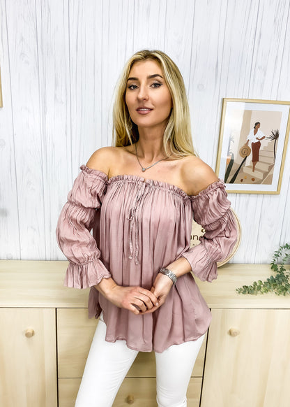Blusa estilo bohemio semitransparente con hombros descubiertos