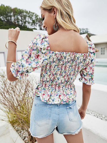 Blusa con estampado de margaritas y mangas abullonadas fruncidas