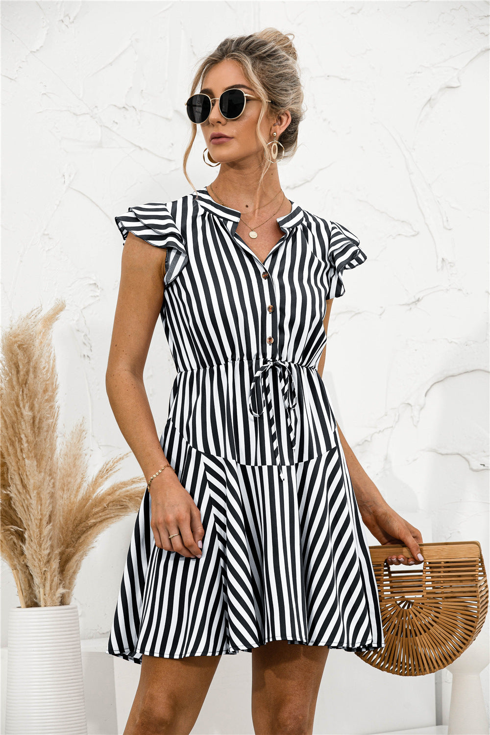 Vestido mini túnica con volantes y rayas