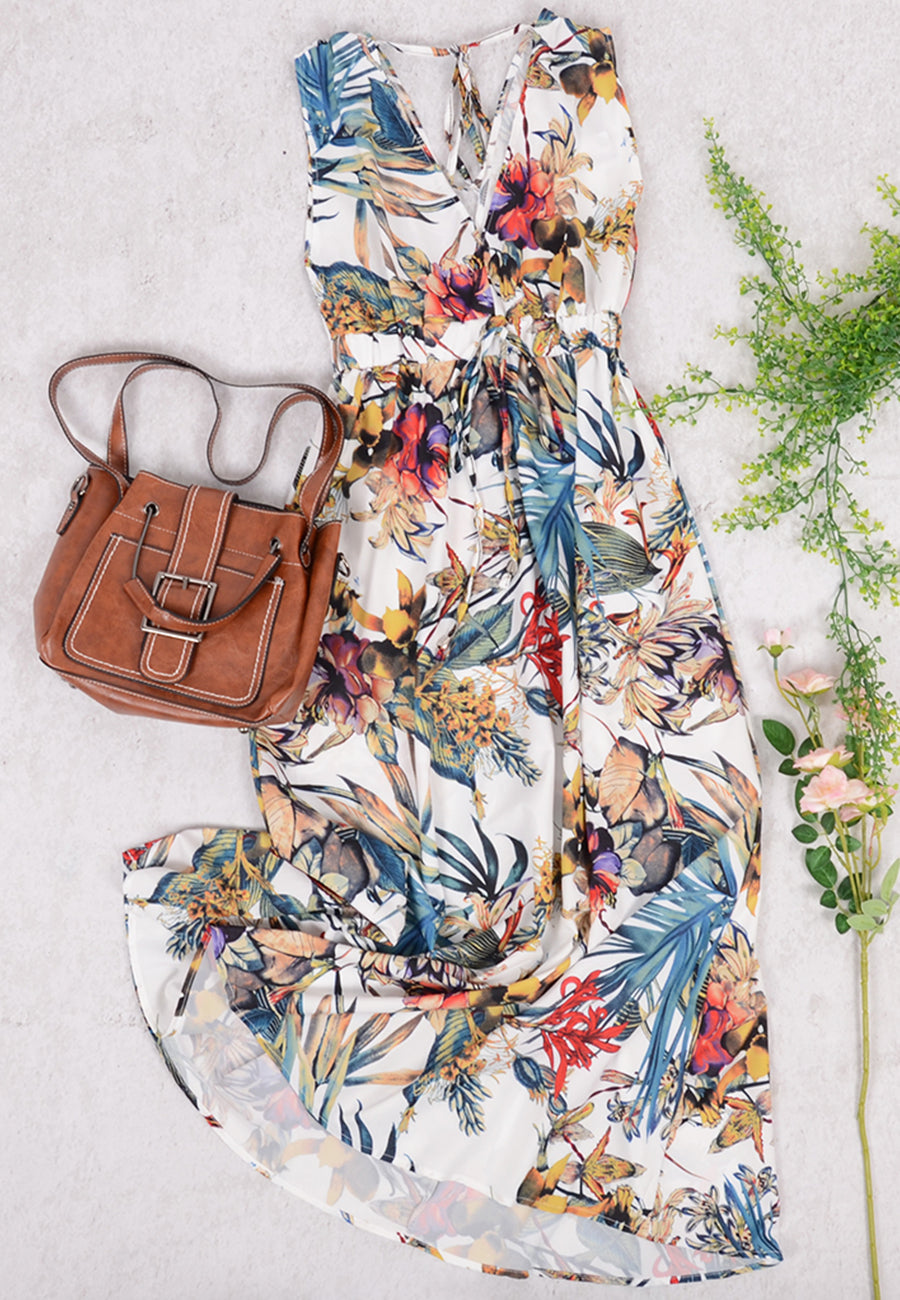 Vestido con estampado tropical y lazo en la espalda