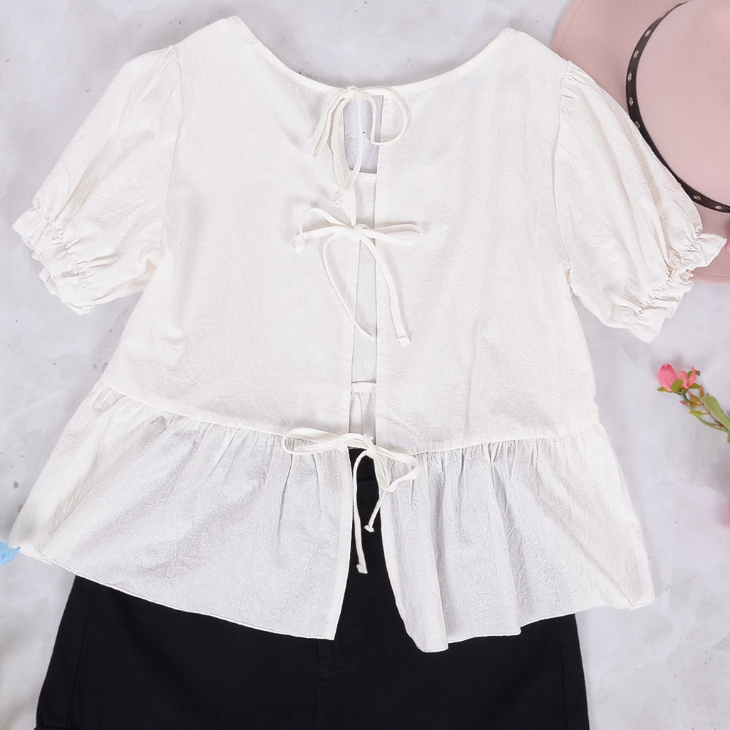 Blusa con lazo en la espalda y mangas abullonadas