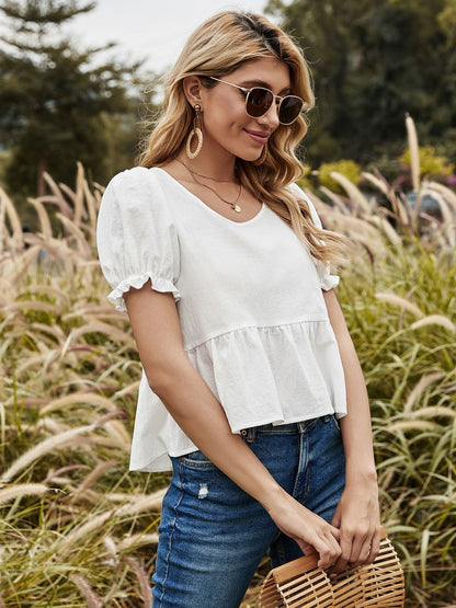 Blusa con lazo en la espalda y mangas abullonadas