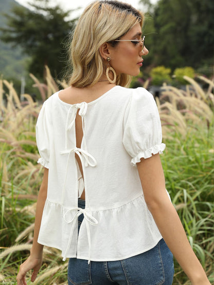 Blusa con lazo en la espalda y mangas abullonadas