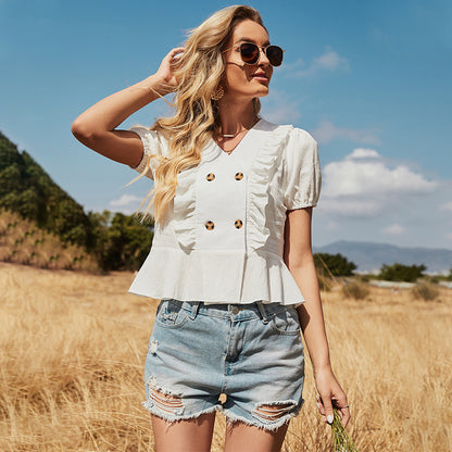 Blusa con botones y mangas abullonadas