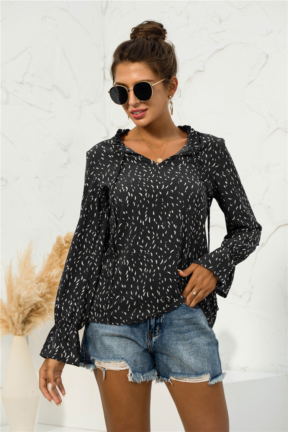 Blusa con mangas abullonadas y estampado suave