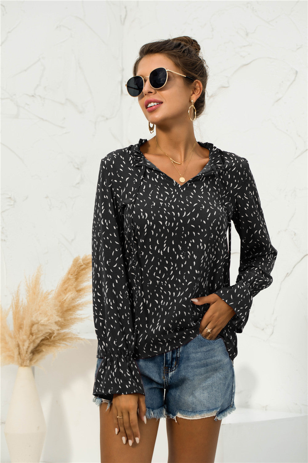 Blusa con mangas abullonadas y estampado suave