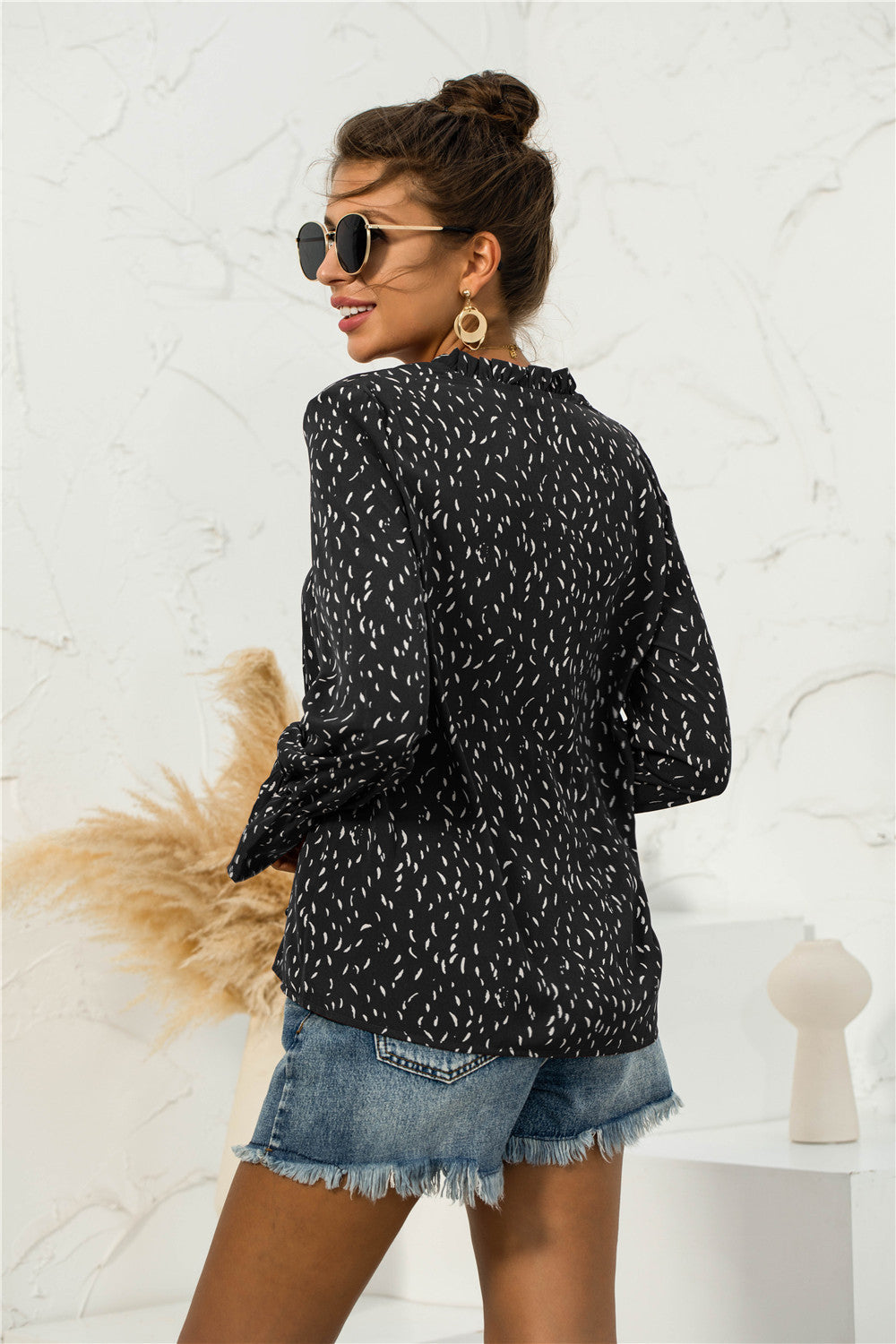 Blusa con mangas abullonadas y estampado suave