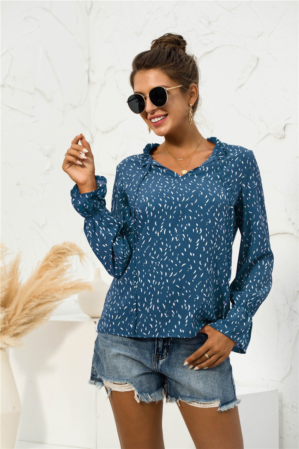 Blusa con mangas abullonadas y estampado suave
