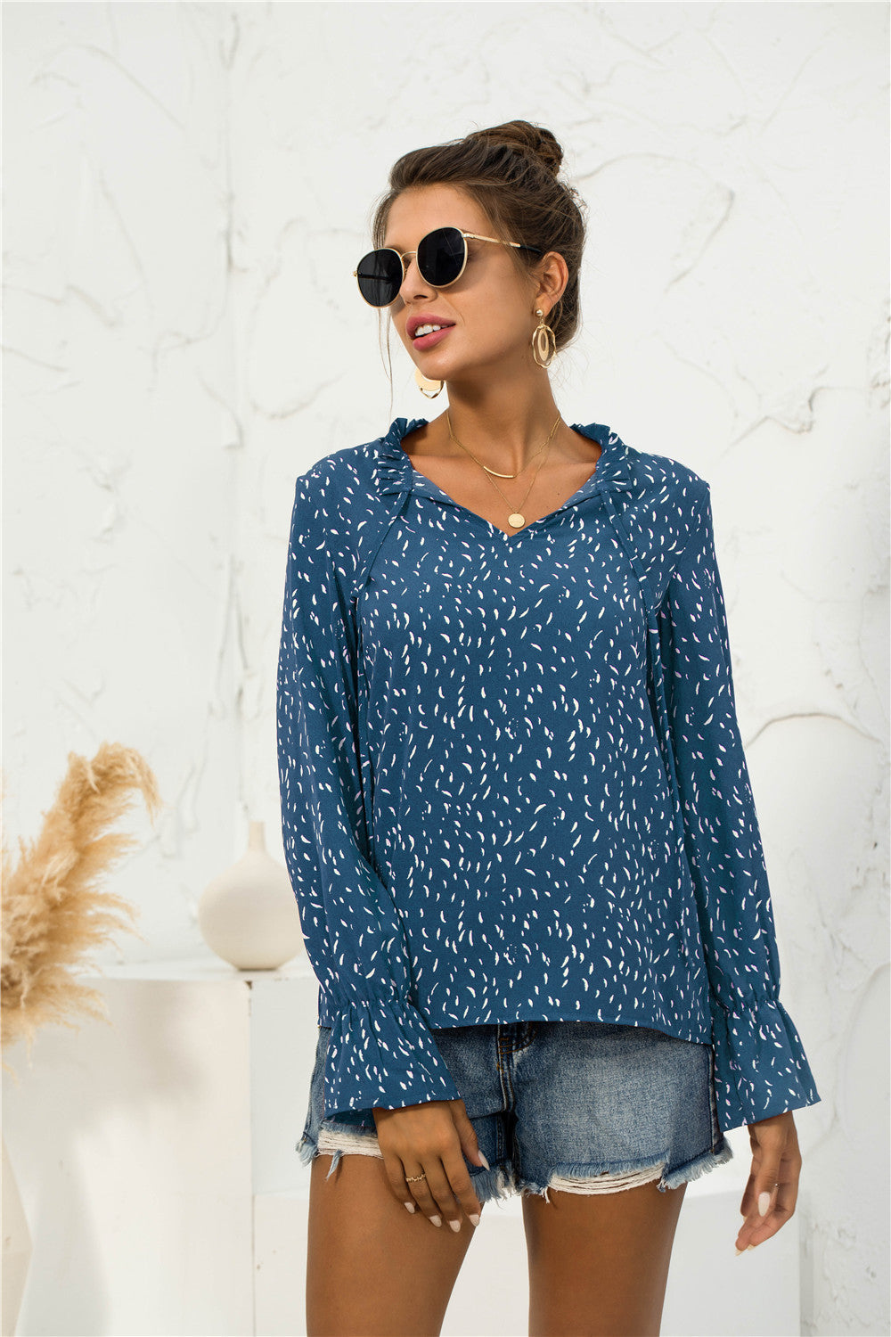 Blusa con mangas abullonadas y estampado suave