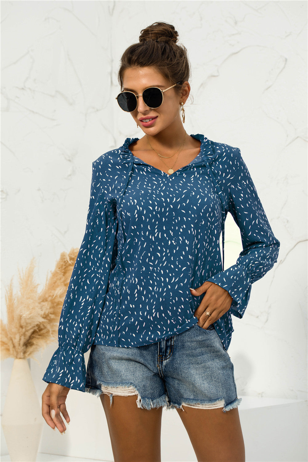 Blusa con mangas abullonadas y estampado suave