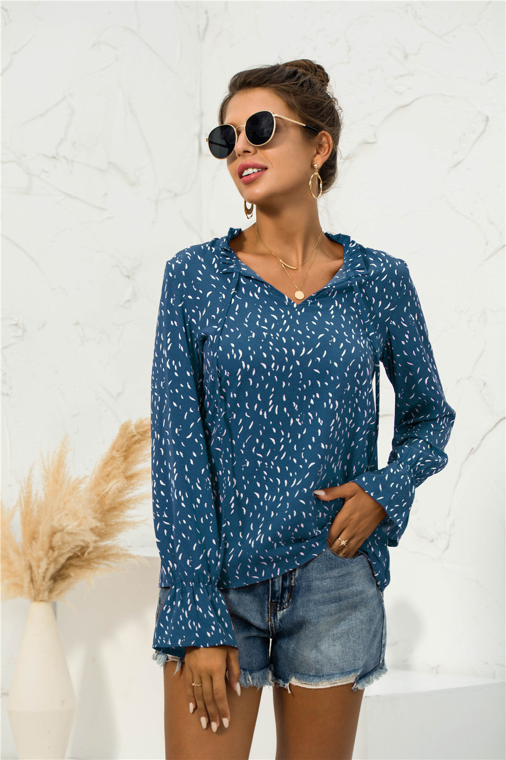 Blusa con mangas abullonadas y estampado suave