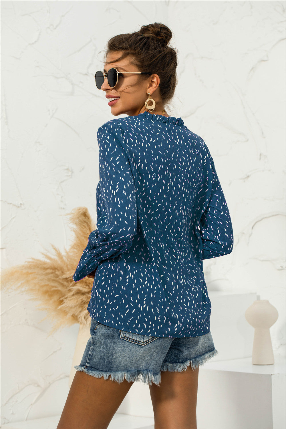 Blusa con mangas abullonadas y estampado suave