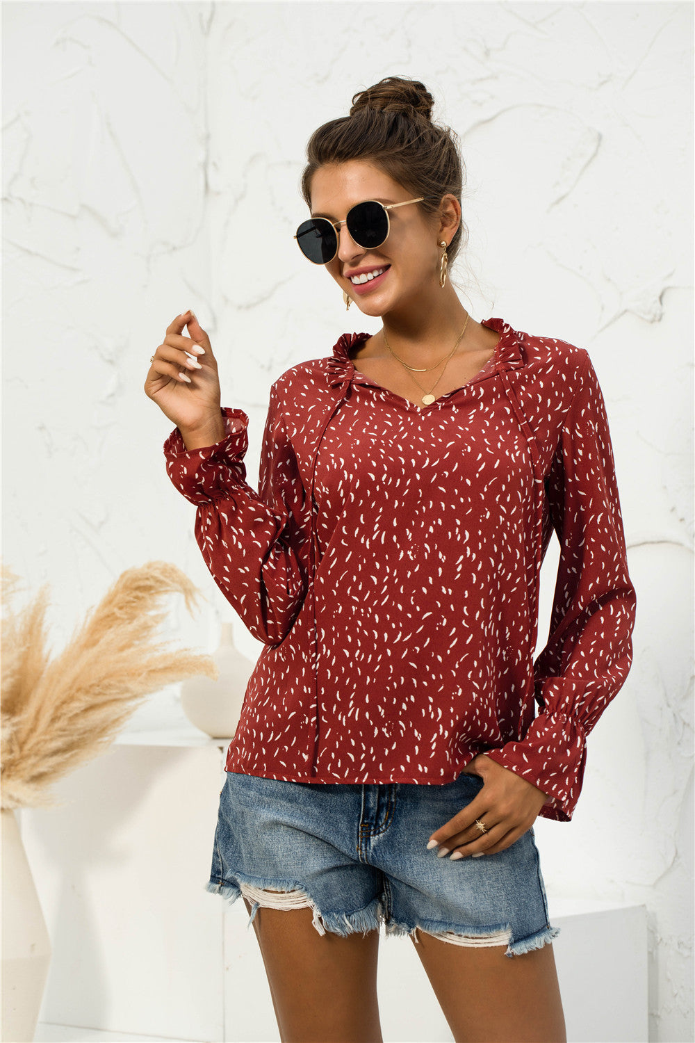 Blusa con mangas abullonadas y estampado suave