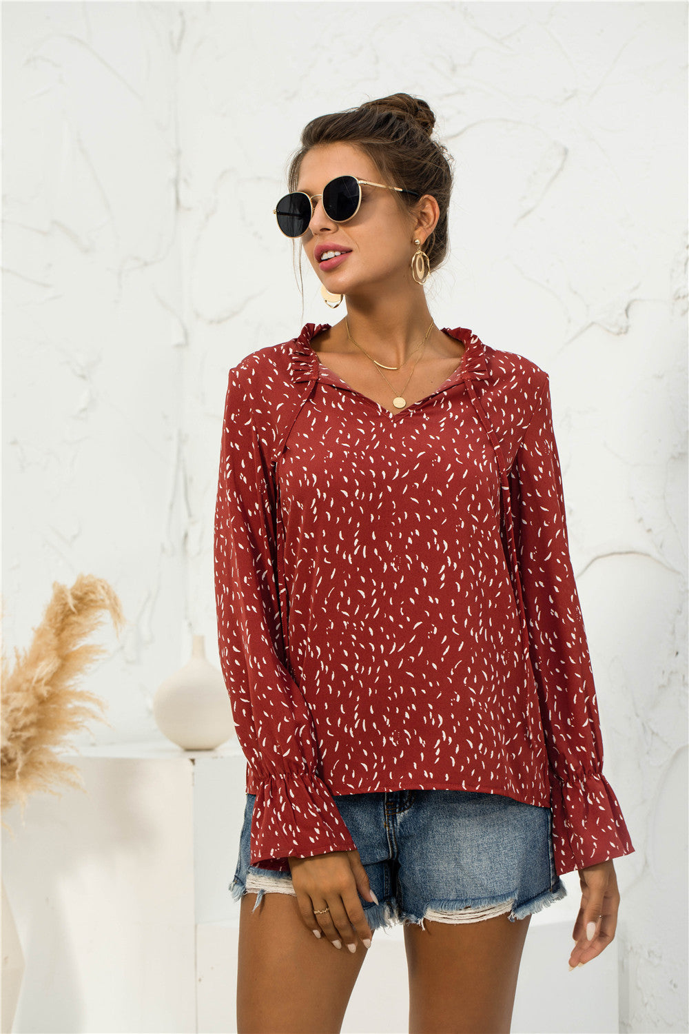 Blusa con mangas abullonadas y estampado suave