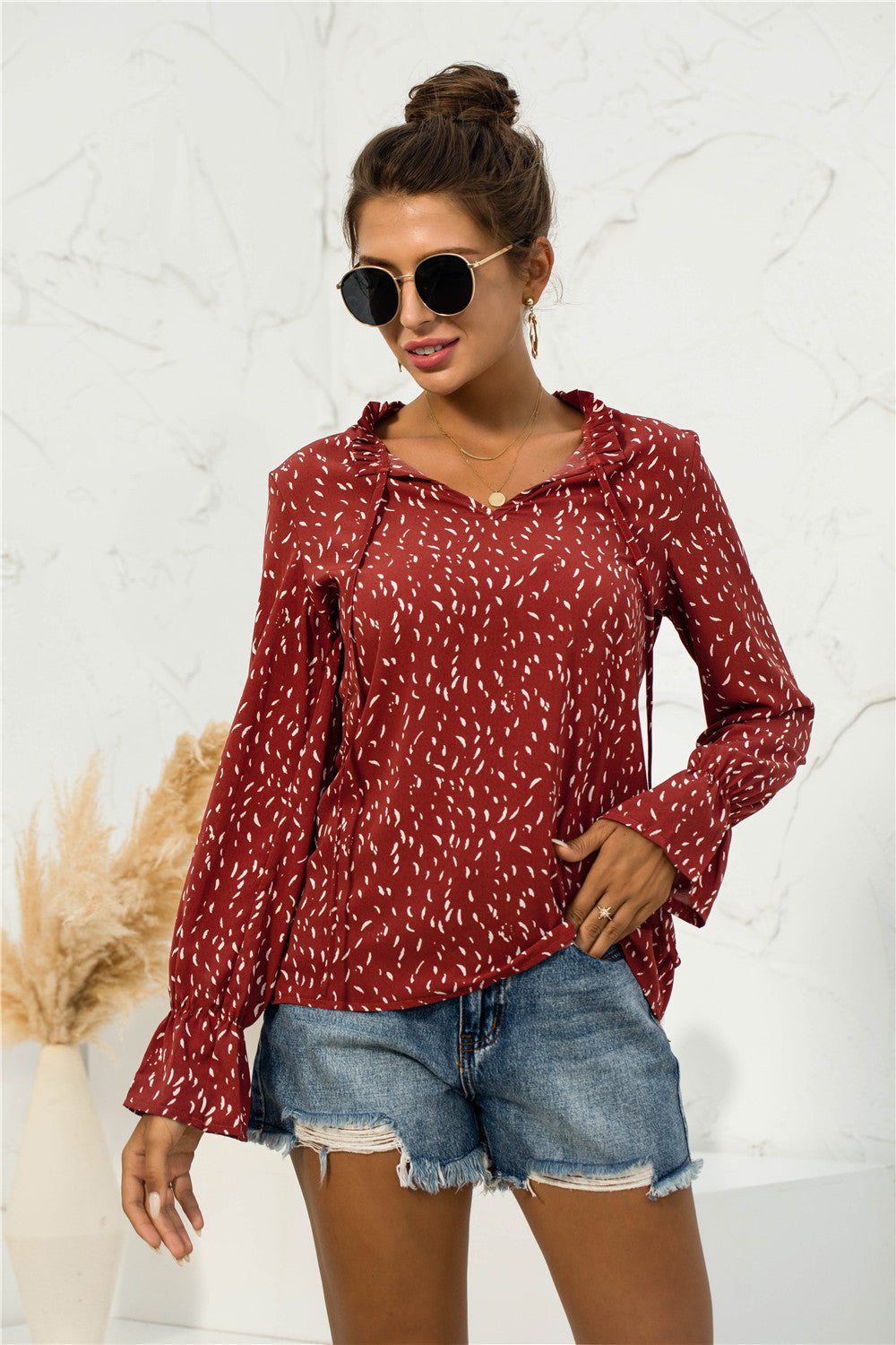 Blusa con mangas abullonadas y estampado suave