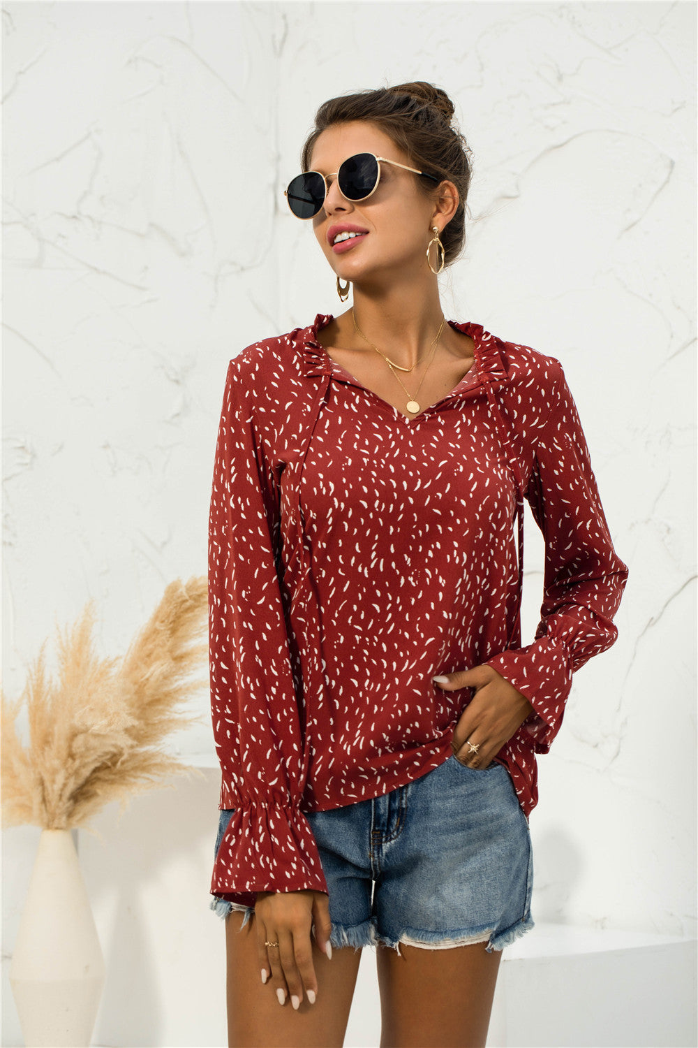 Blusa con mangas abullonadas y estampado suave