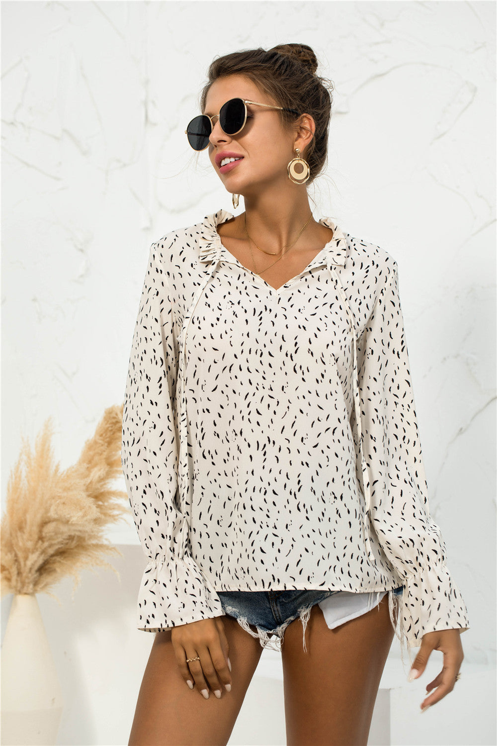 Blusa con mangas abullonadas y estampado suave