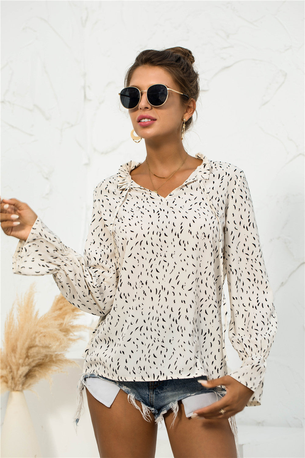 Blusa con mangas abullonadas y estampado suave