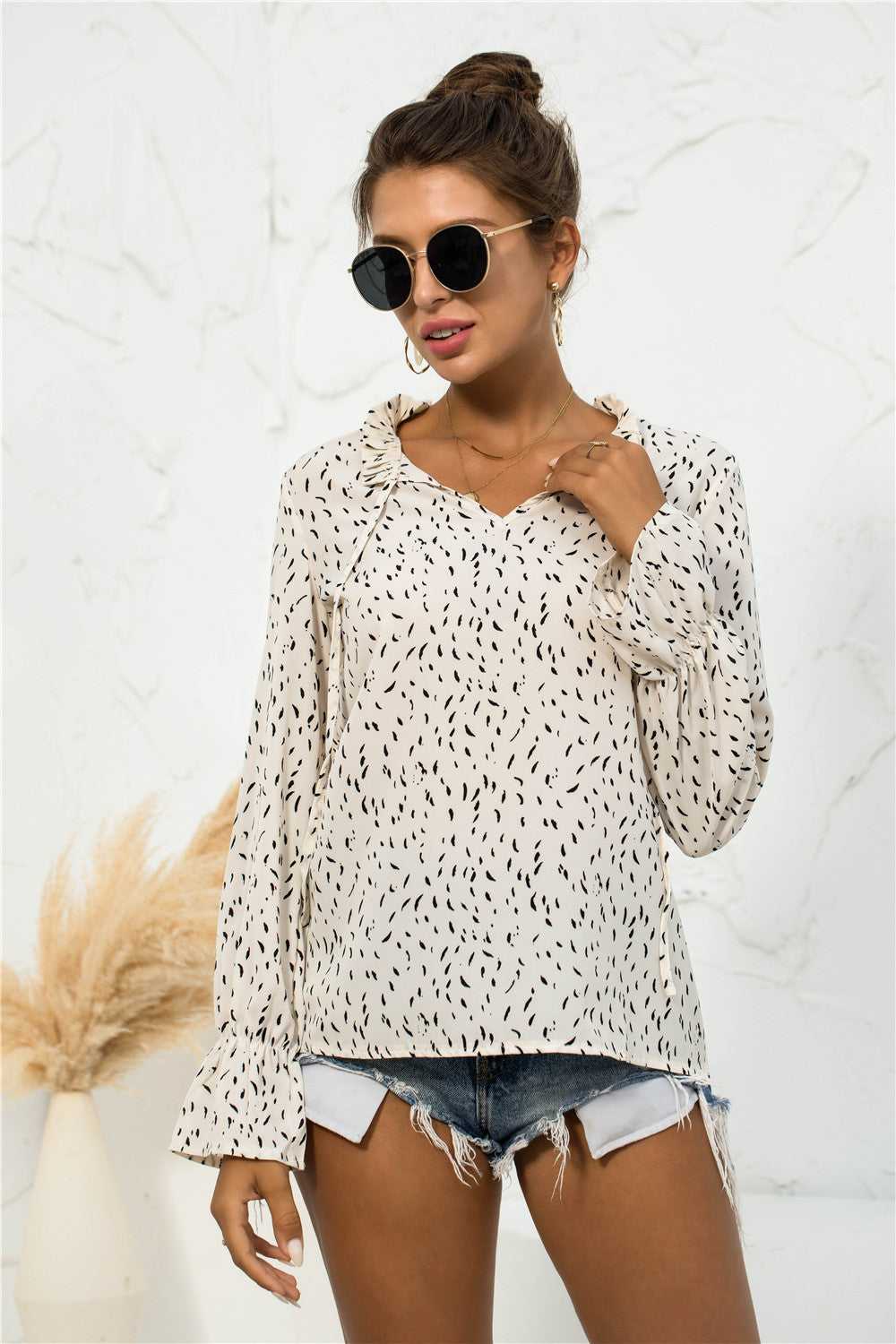 Blusa con mangas abullonadas y estampado suave