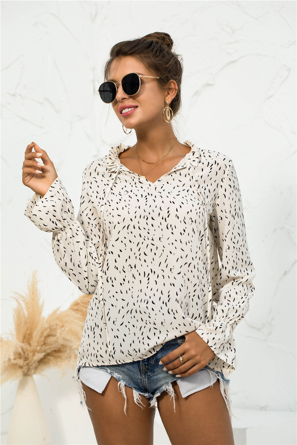 Blusa con mangas abullonadas y estampado suave