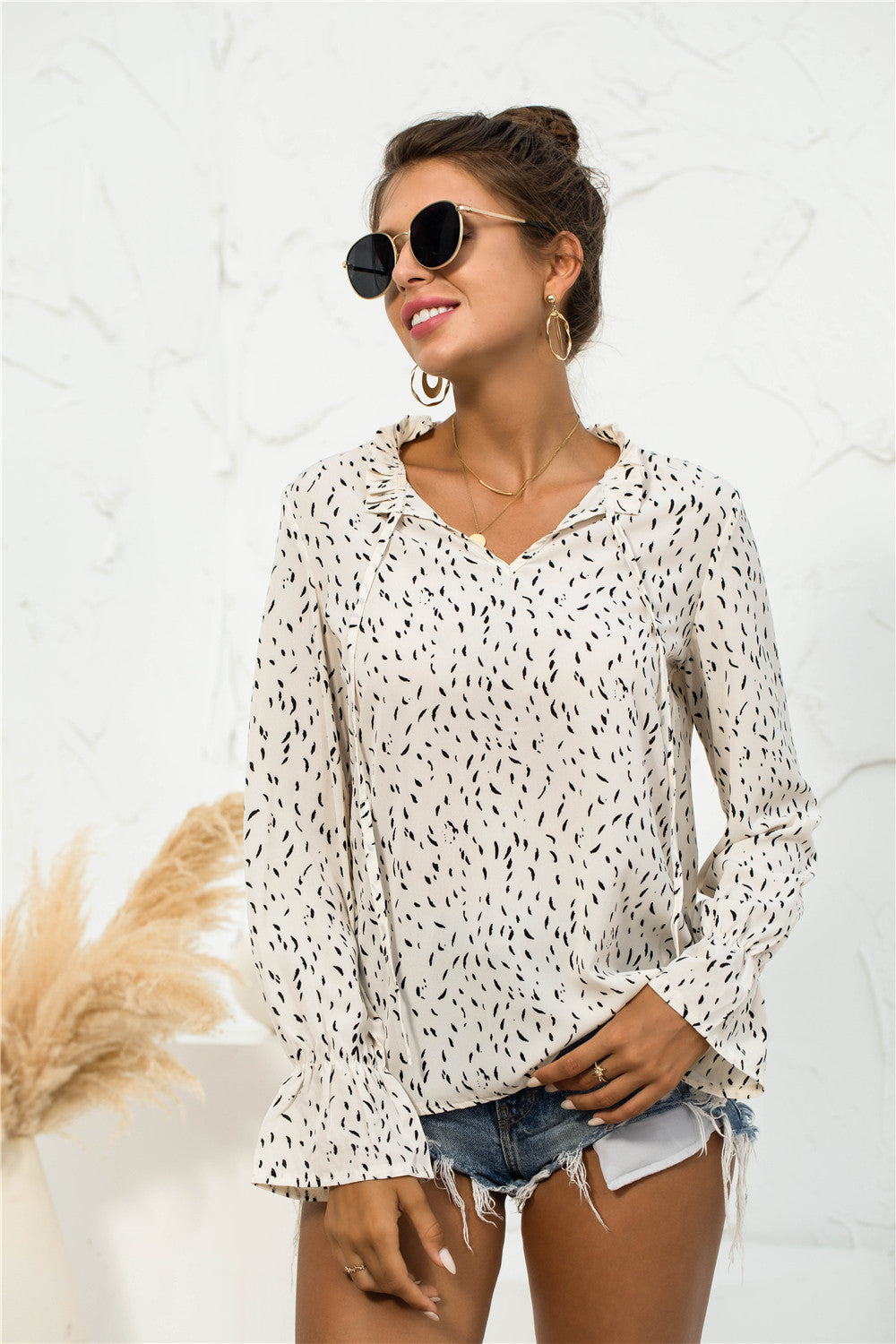 Blusa con mangas abullonadas y estampado suave