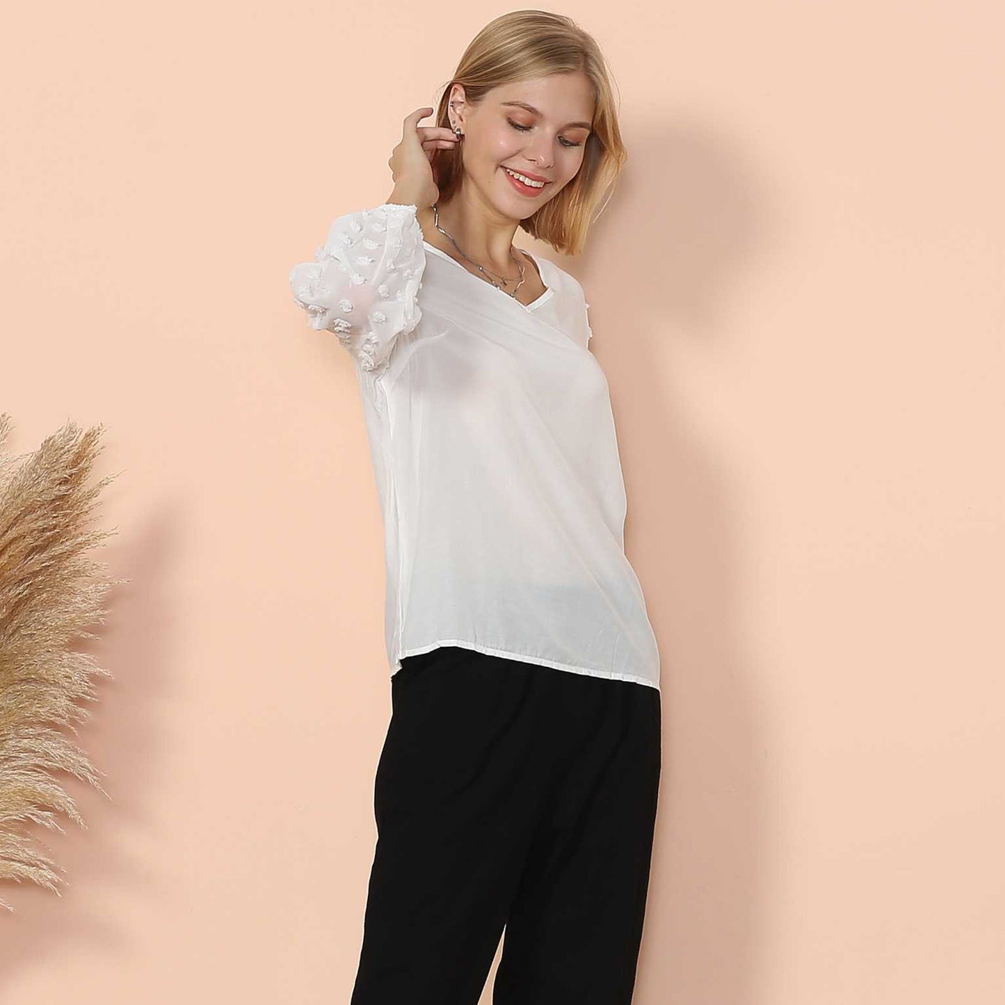 Blusa de manga larga con lunares y clip