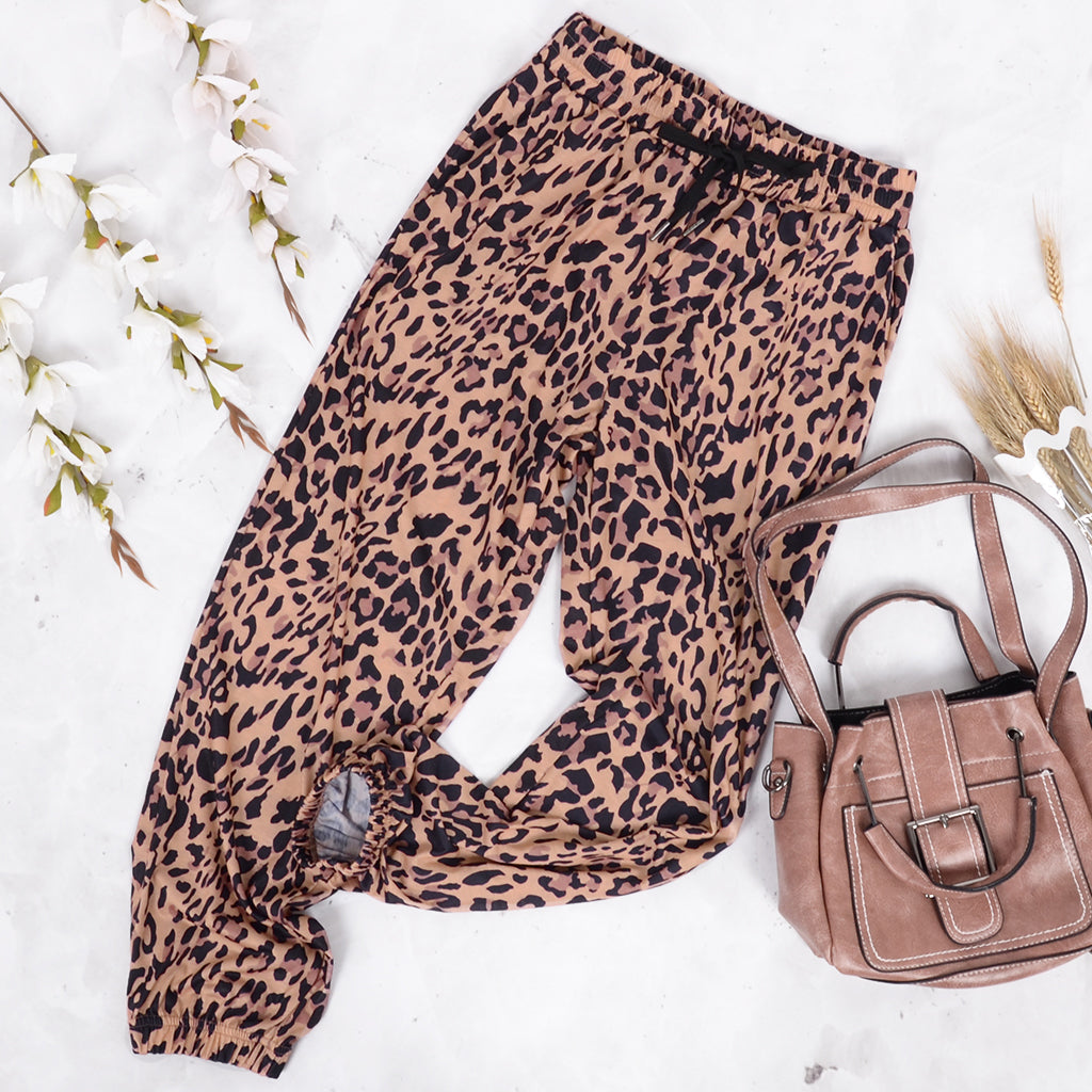 Pantalones de lujo con cordón y estampado de leopardo