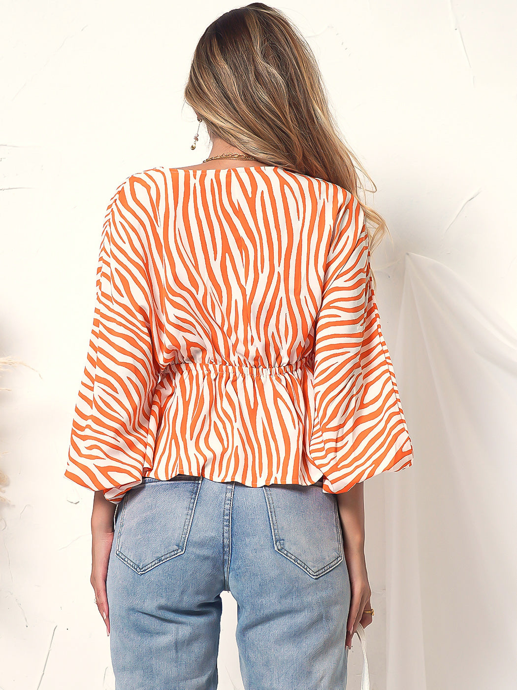 Blusa de manga larga con botones y estampado de cebra 