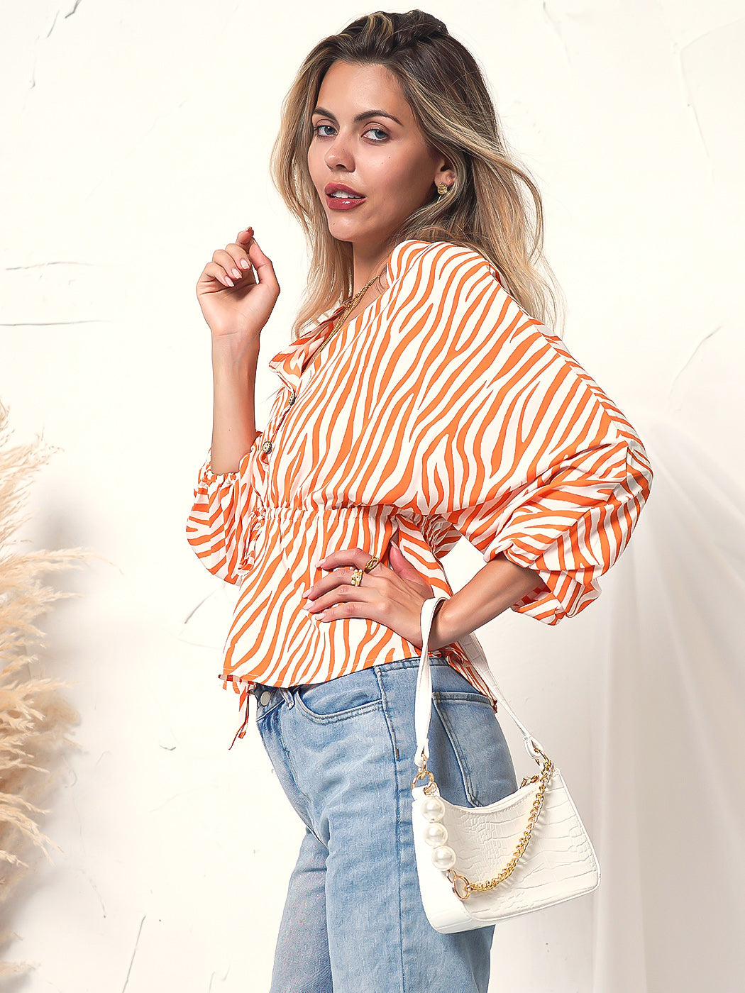 Blusa de manga larga con botones y estampado de cebra 