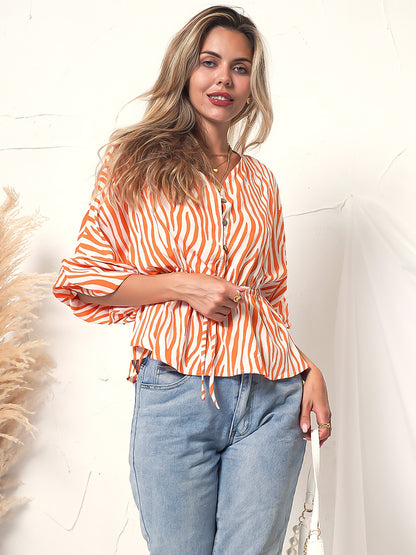 Blusa de manga larga con botones y estampado de cebra 