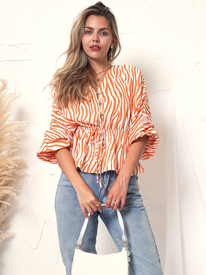 Blusa de manga larga con botones y estampado de cebra 