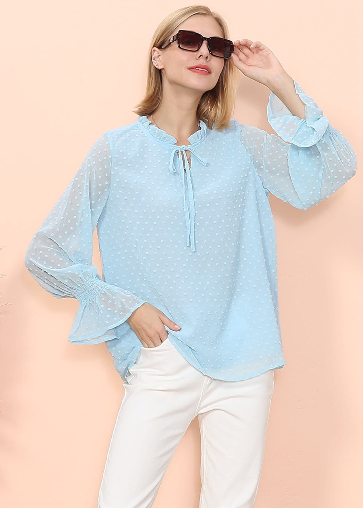 Blusa tipo suéter de manga larga con lunares y clip