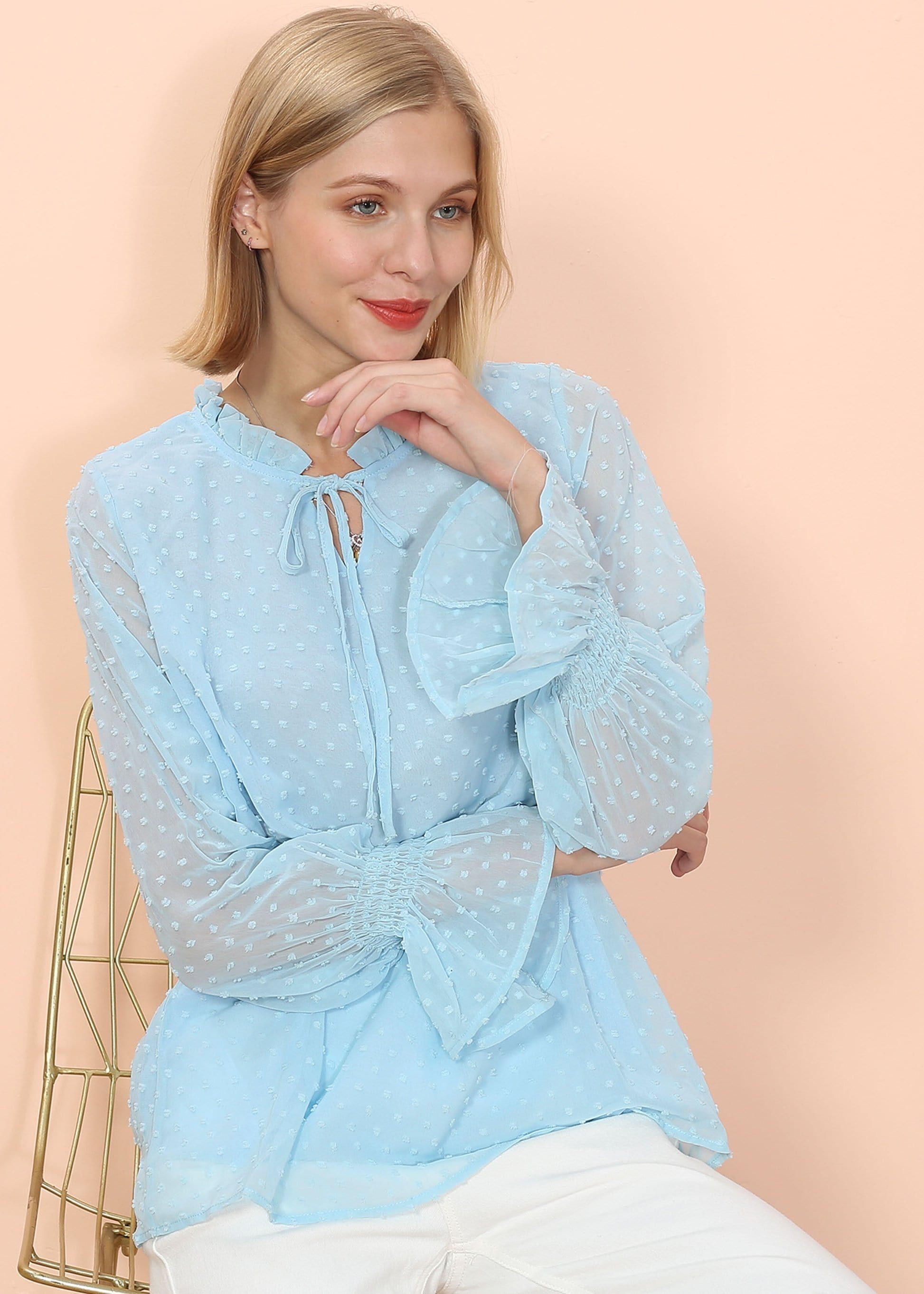 Blusa tipo suéter de manga larga con lunares y clip