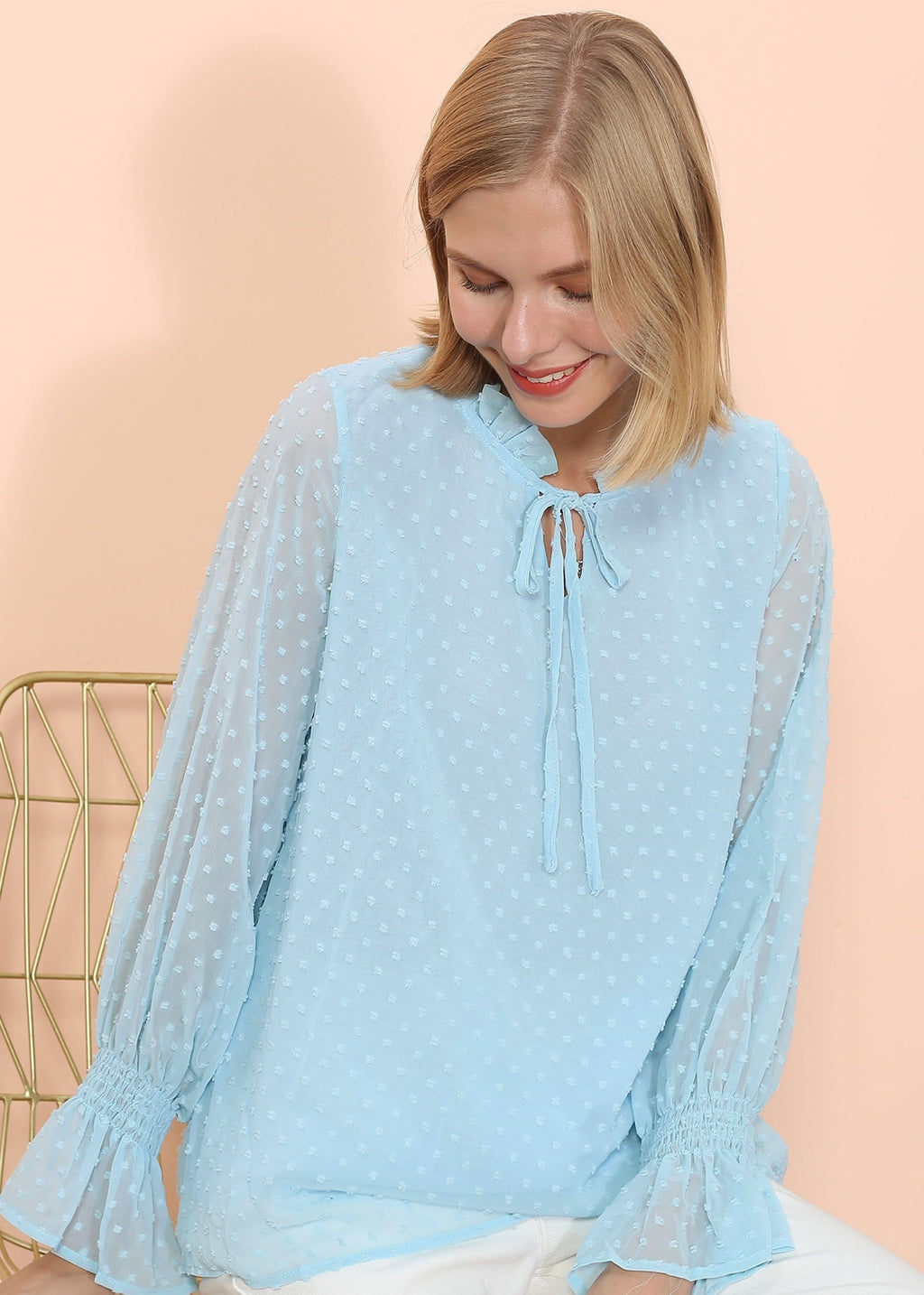 Blusa tipo suéter de manga larga con lunares y clip