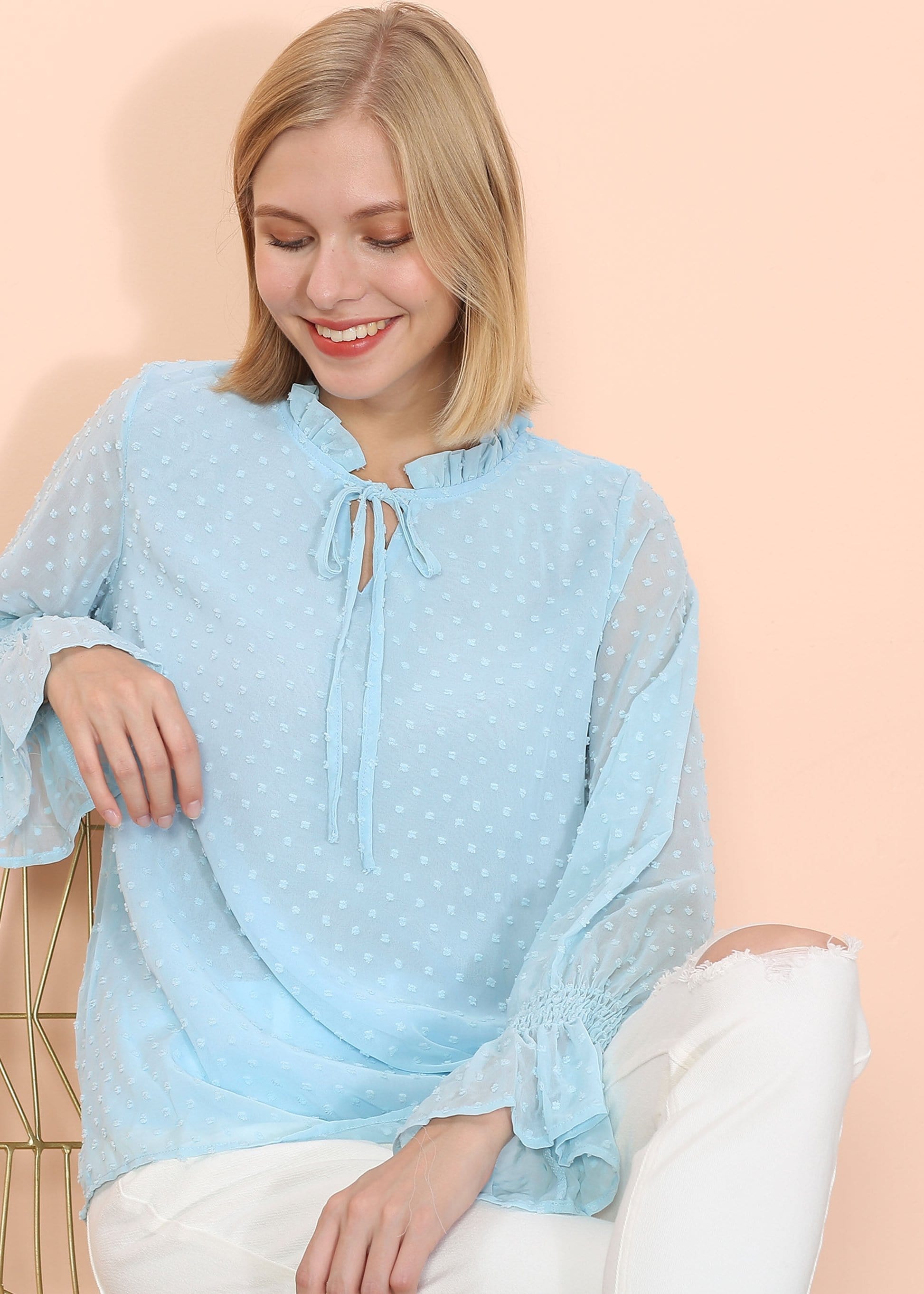 Blusa tipo suéter de manga larga con lunares y clip