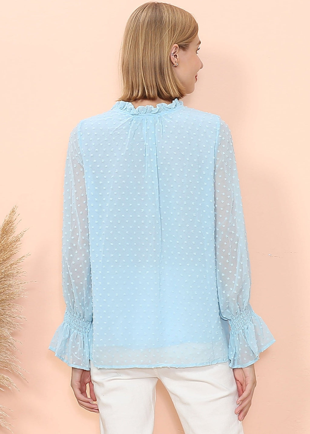 Blusa tipo suéter de manga larga con lunares y clip