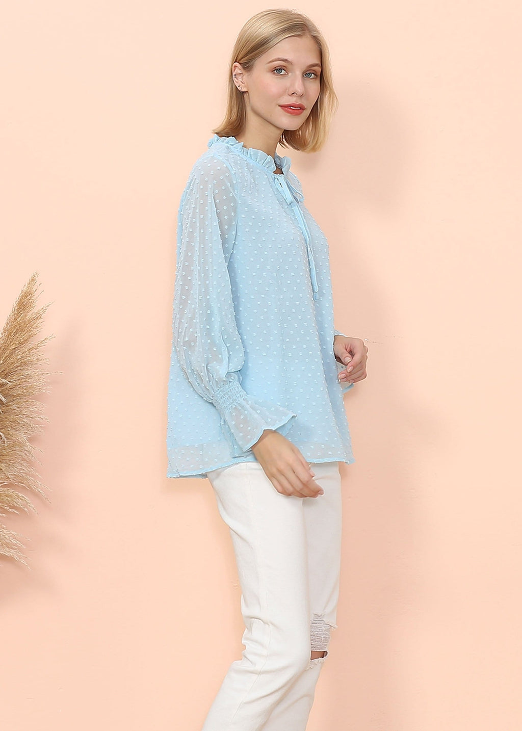 Blusa tipo suéter de manga larga con lunares y clip