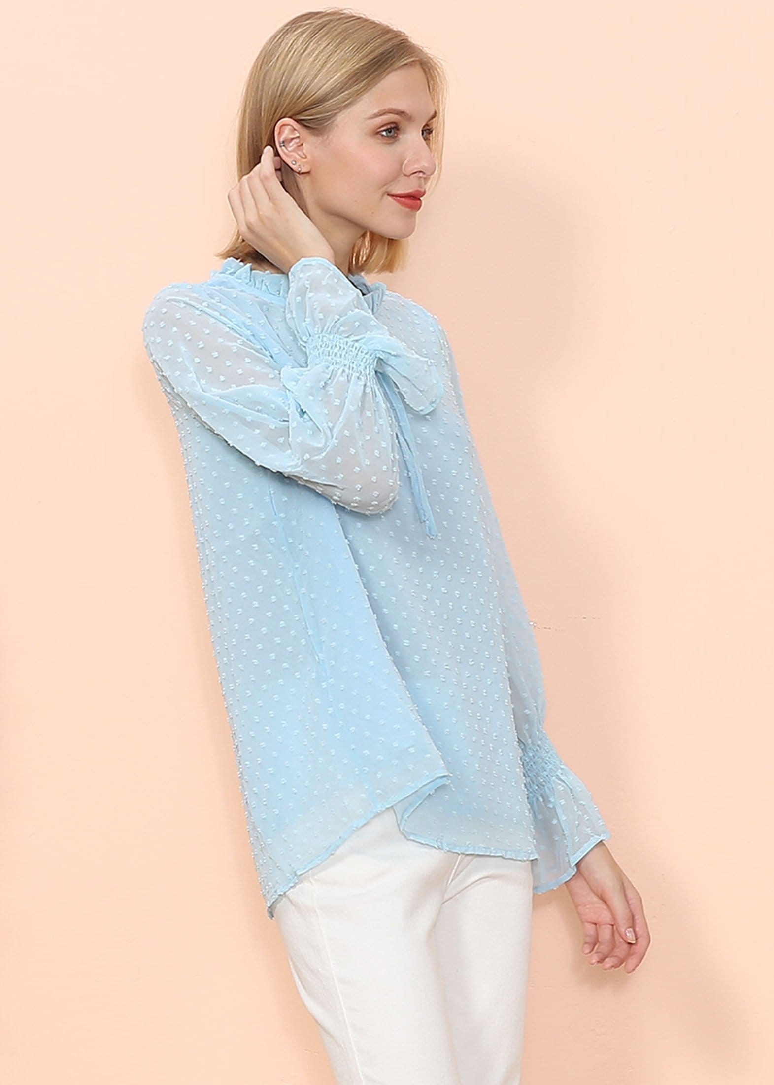 Blusa tipo suéter de manga larga con lunares y clip