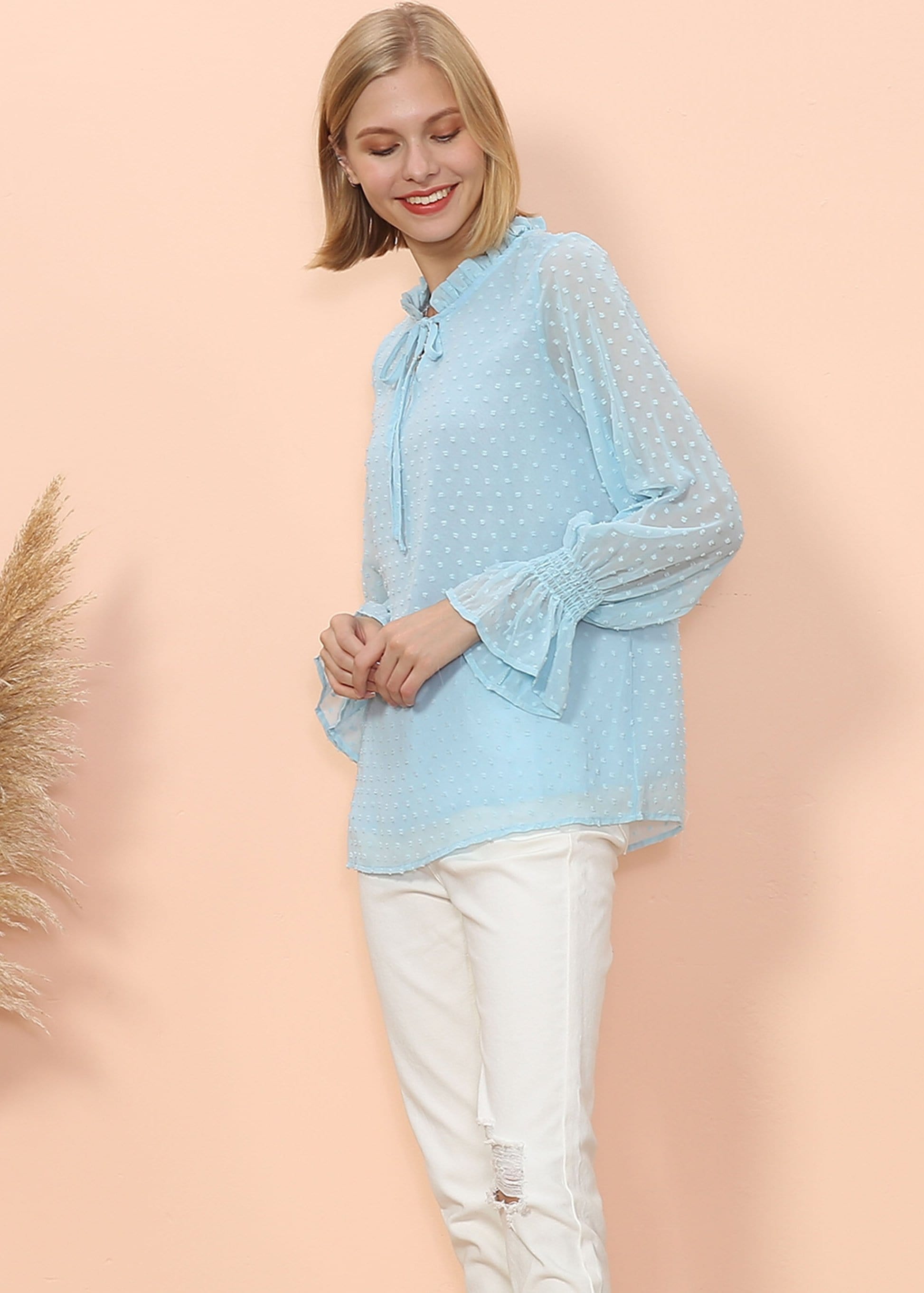 Blusa tipo suéter de manga larga con lunares y clip