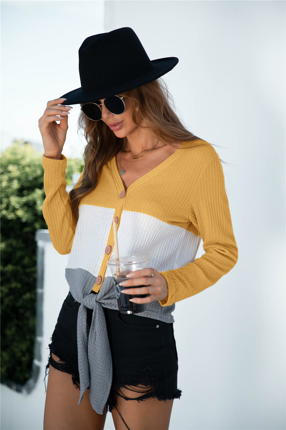 Camisa de punto con botones y manga larga en bloques de color