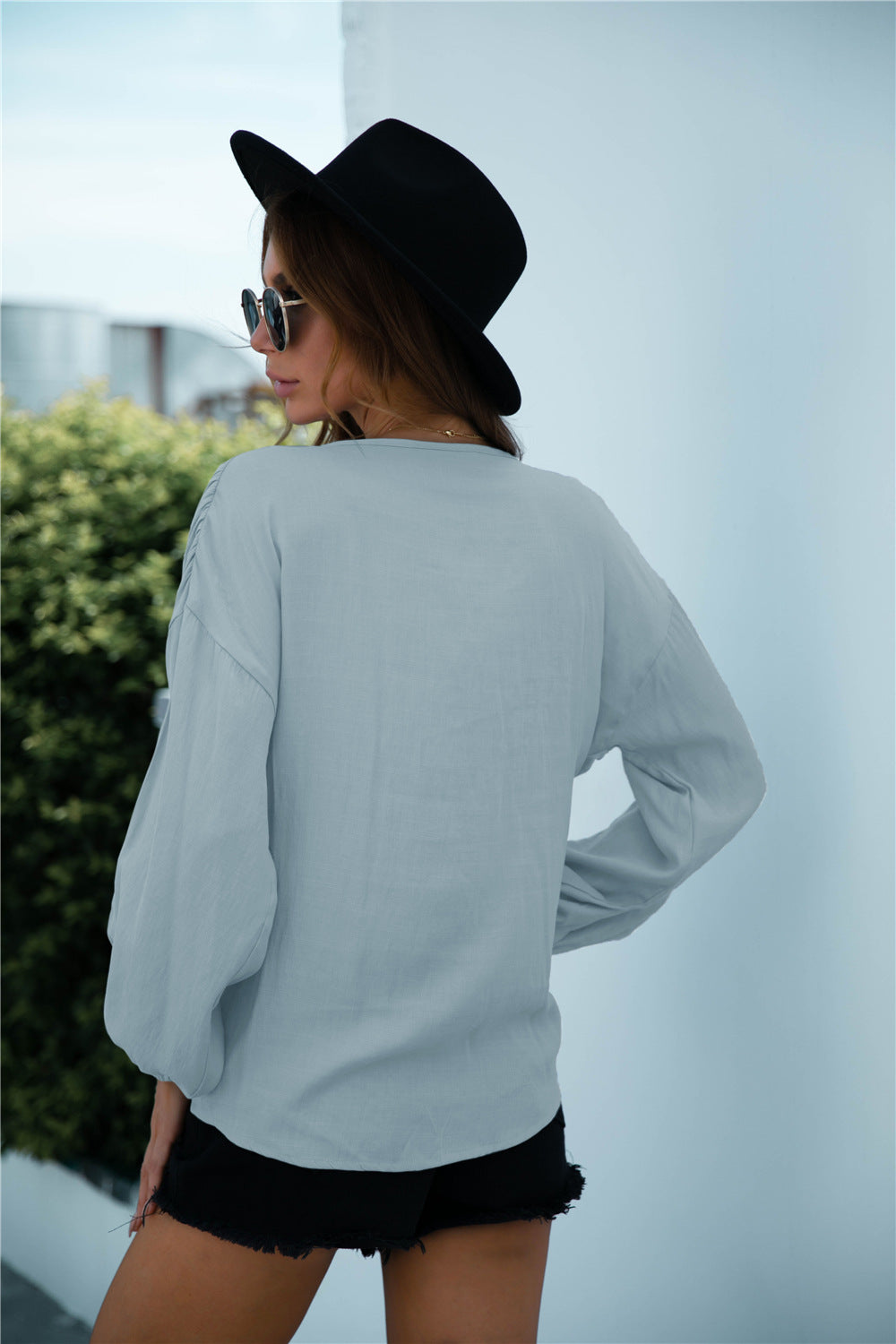 Blusa de manga larga con volantes y cordón anudado