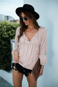 Blusa de manga larga con volantes y cordón anudado