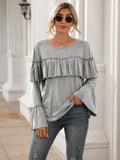 Blusa de manga larga con volantes en el pecho