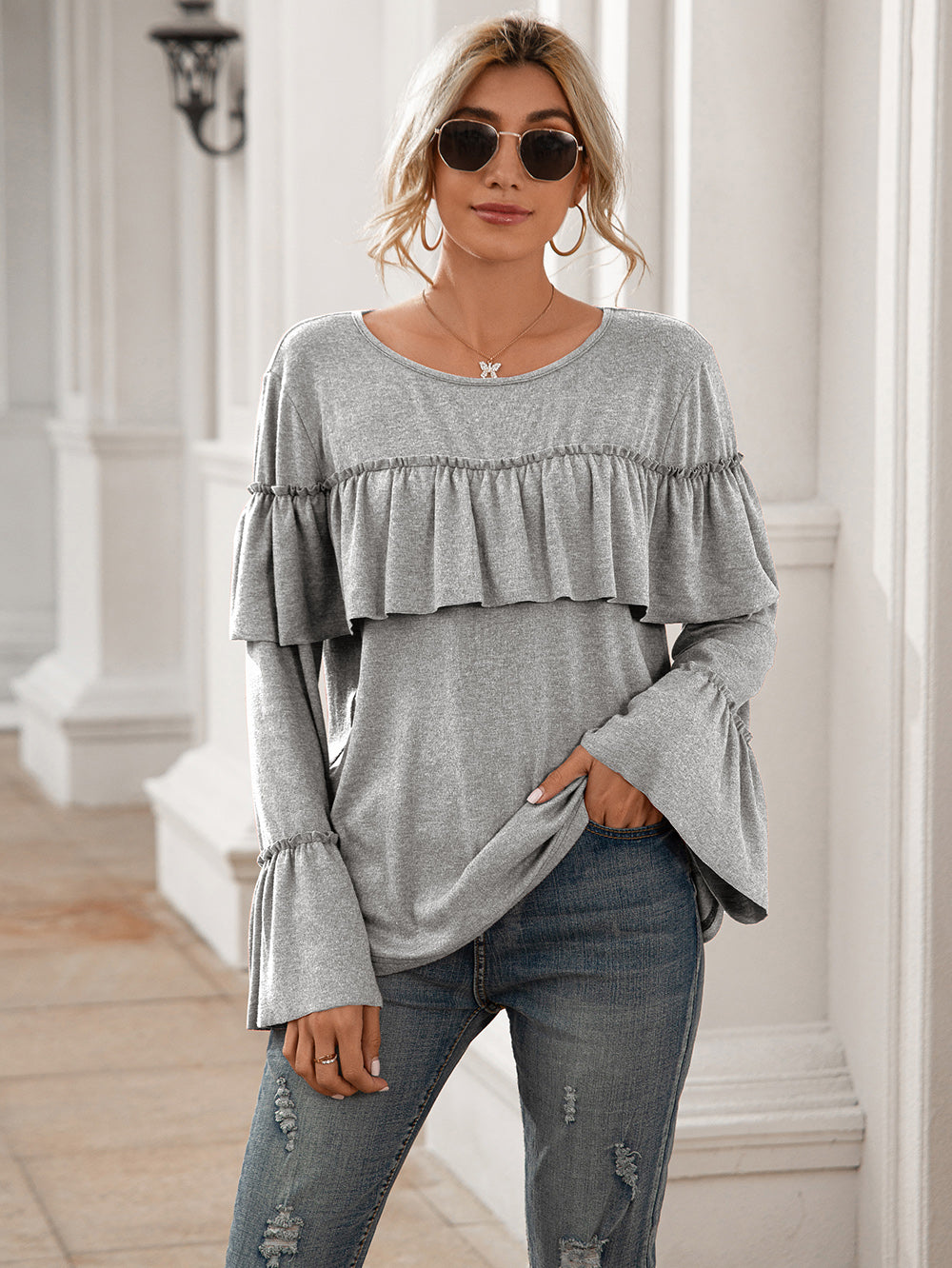 Blusa de manga larga con volantes en el pecho